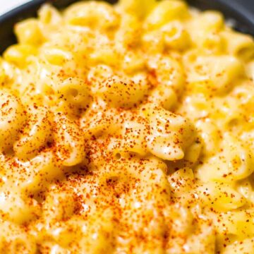 close-up of mac and cheese in a grey baking dish