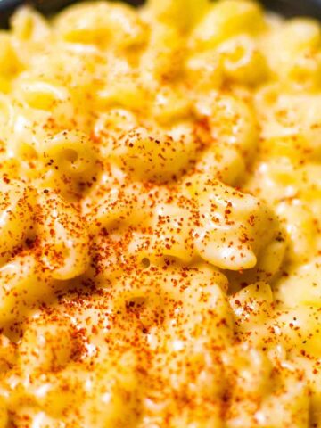 close-up of mac and cheese in a grey baking dish