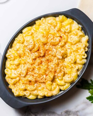 close-up of mac and cheese in a grey baking dish
