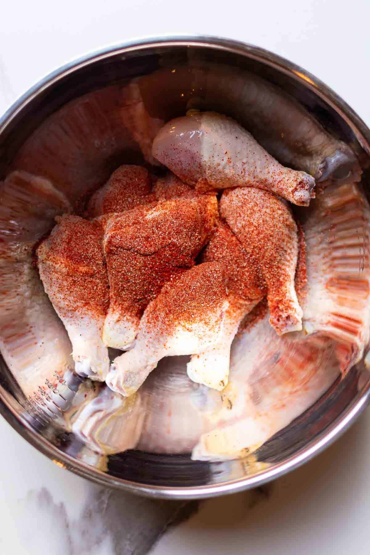 The chicken legs covered in the dry rub seasoning