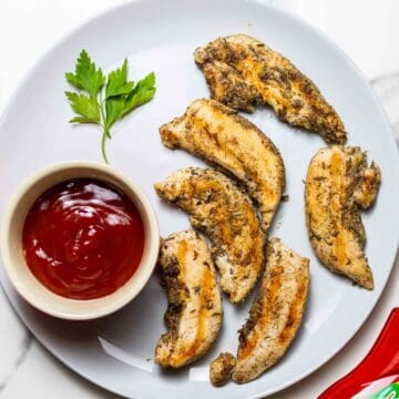 instant pot chicken tenders on gray dish next to ketchup sauce