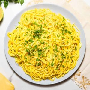 dish with lemon garlic pasta and chopped parsley on top