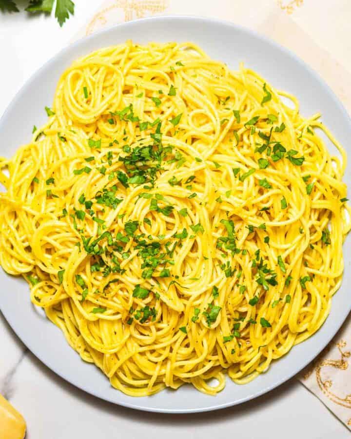 dish with lemon garlic pasta and chopped parsley on top