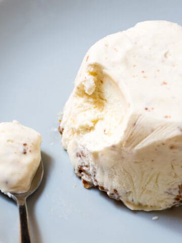 close-up of vanilla ice cream with a spoon near it