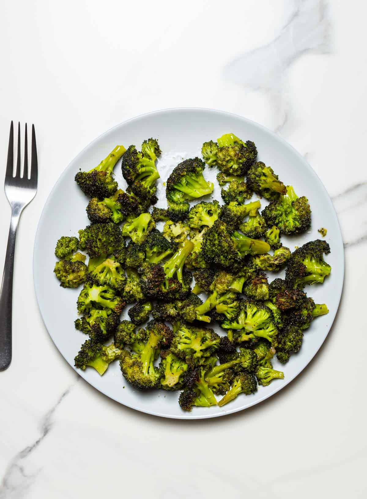 air fryer frozen broccoli in a grey dish