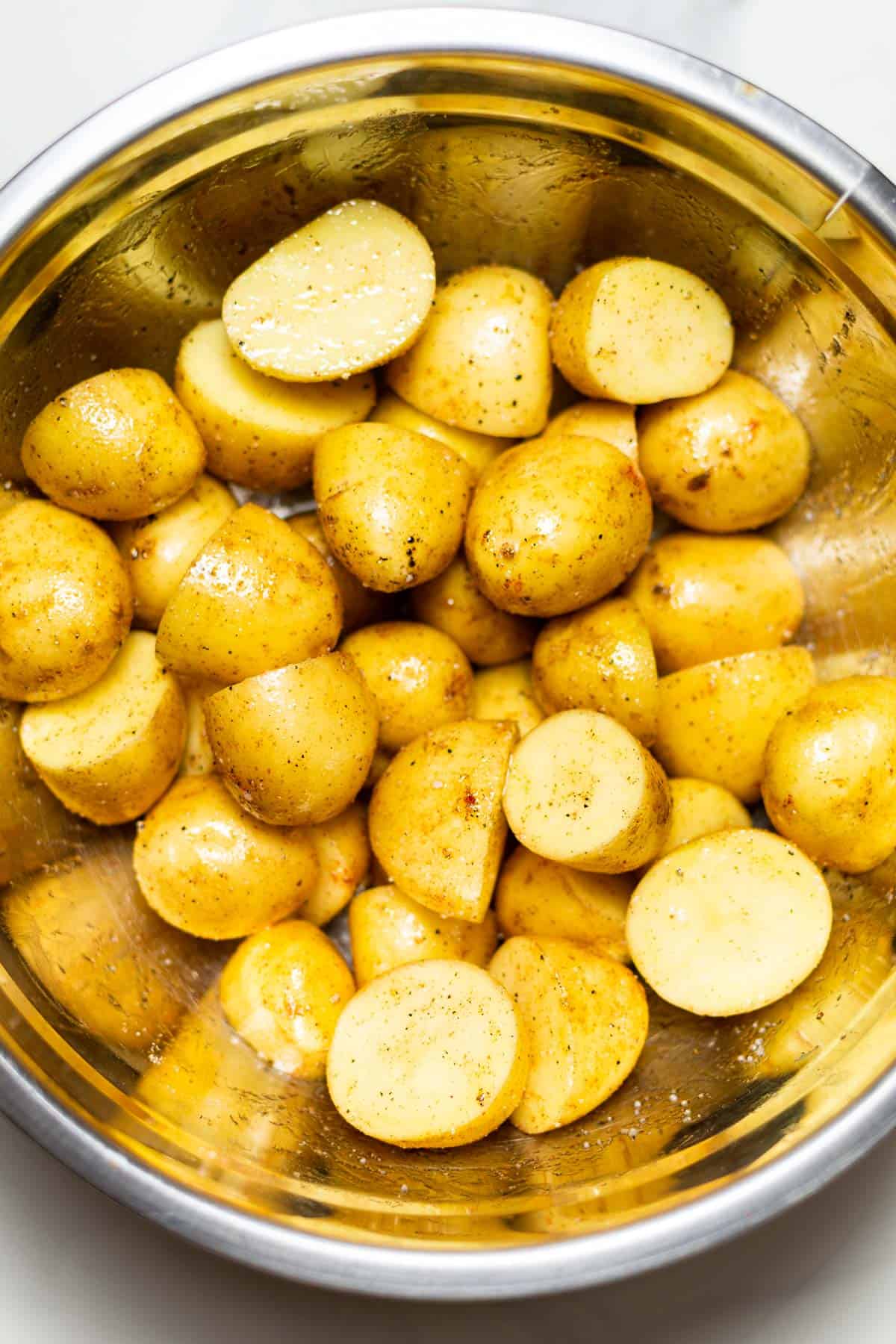 yukon gold baby potatoes sliced in half and seasoned