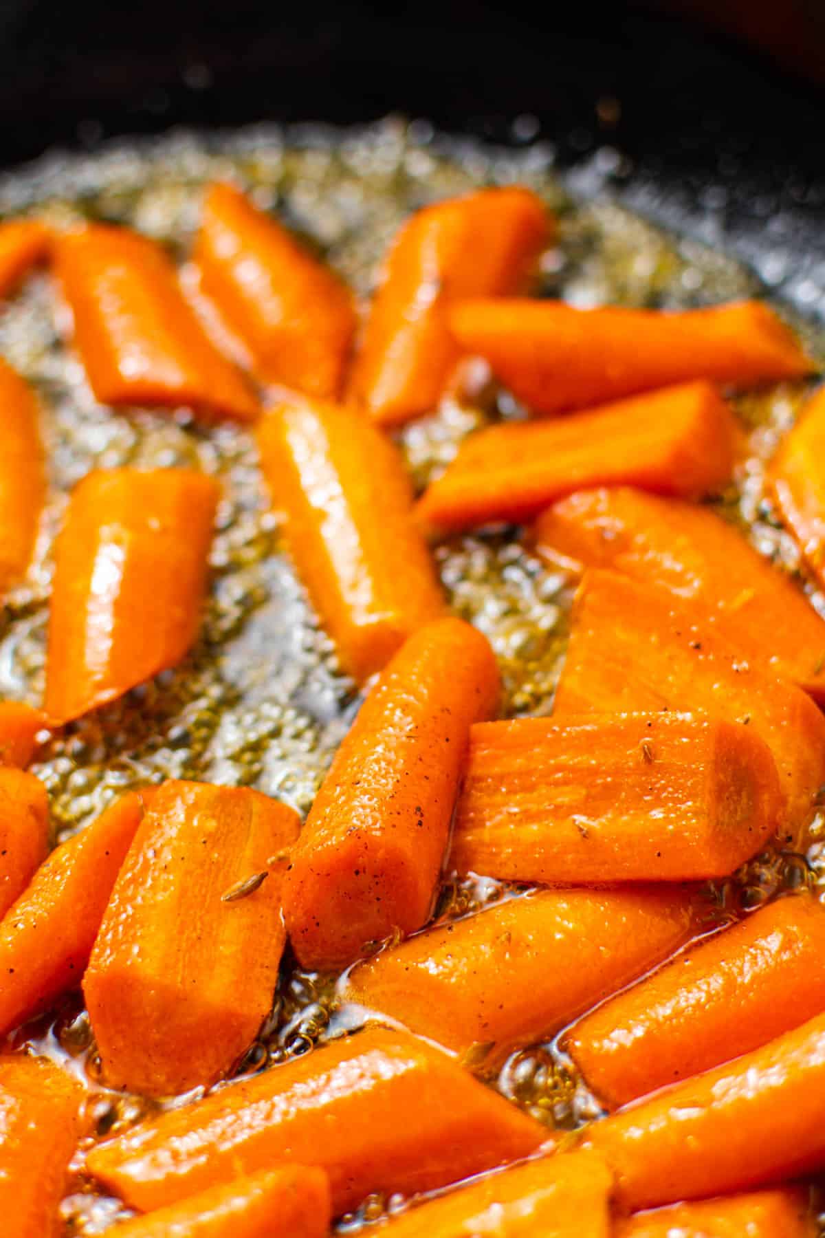 carrots glazed with butter in a saucepan