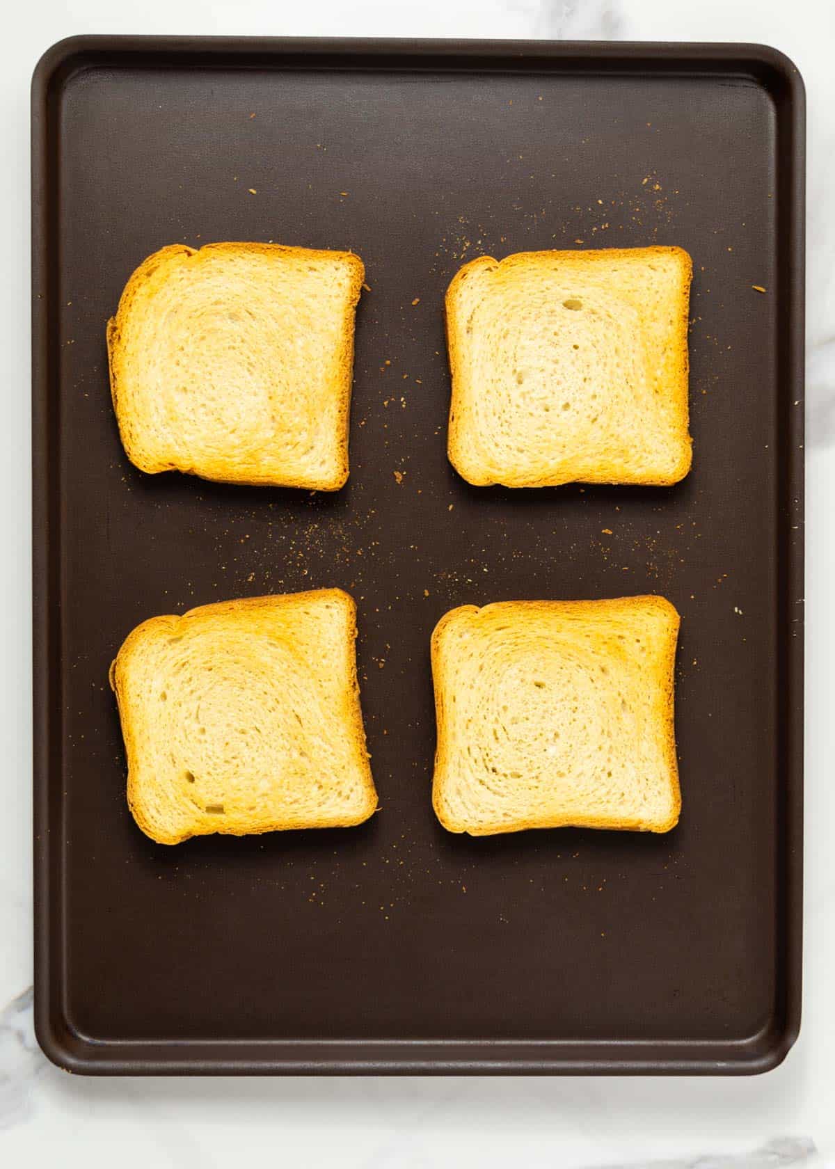 bread slices baked on a baking sheet.