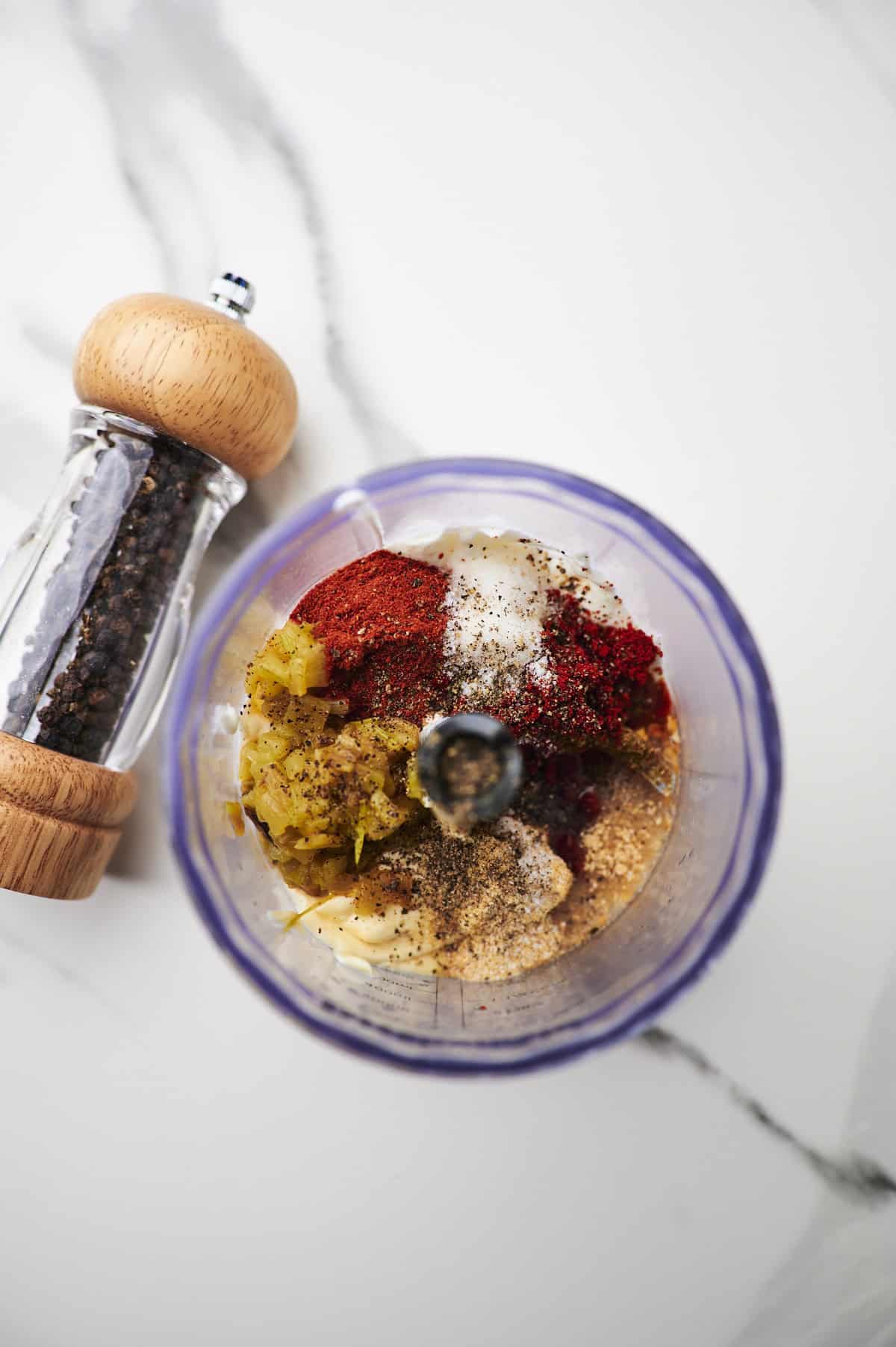 Food processor filled with ingredients to make Taco Bell quesadilla sauce.