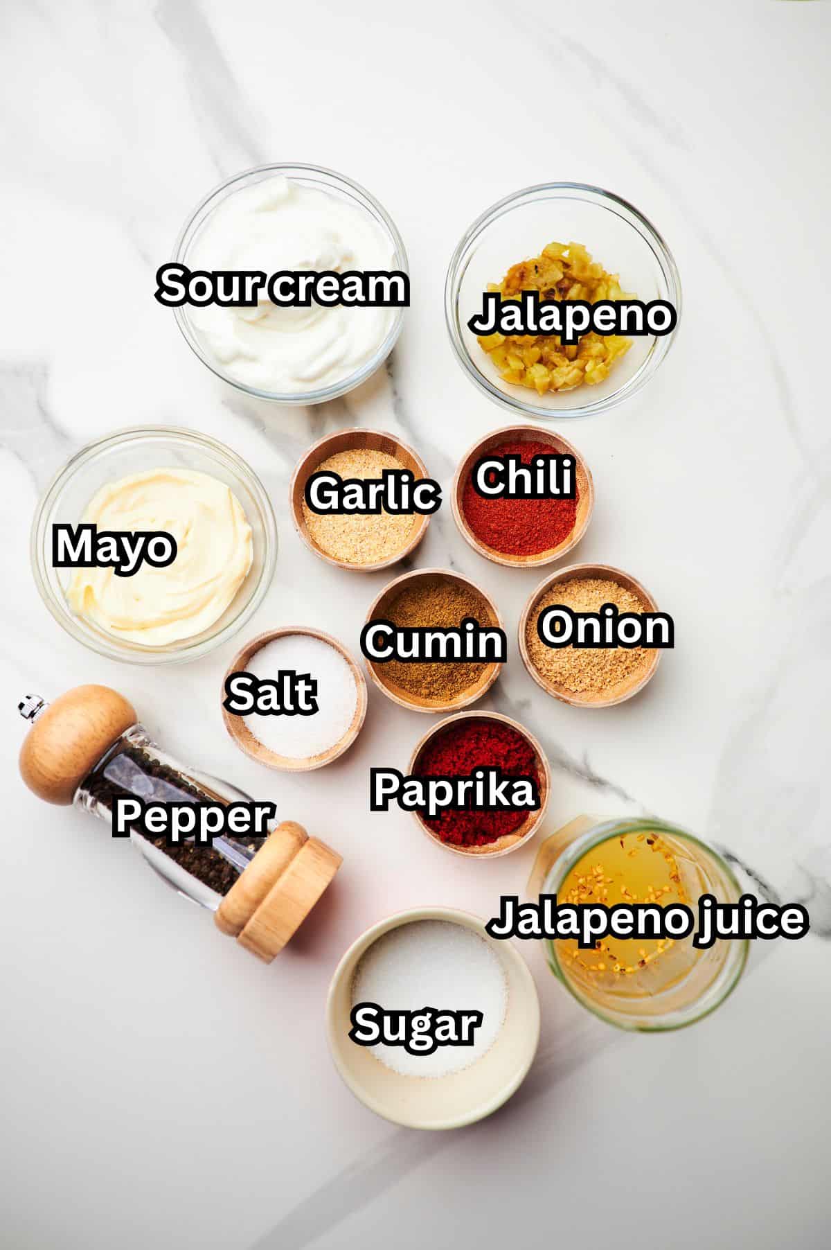 Small bowls of ingredients to make homemade quesadilla sauce.