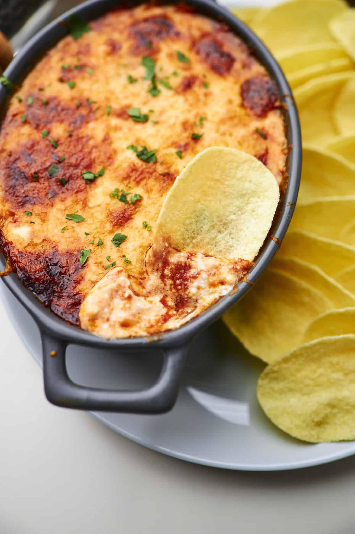 cream cheese salsa dip with a chip dipped in 