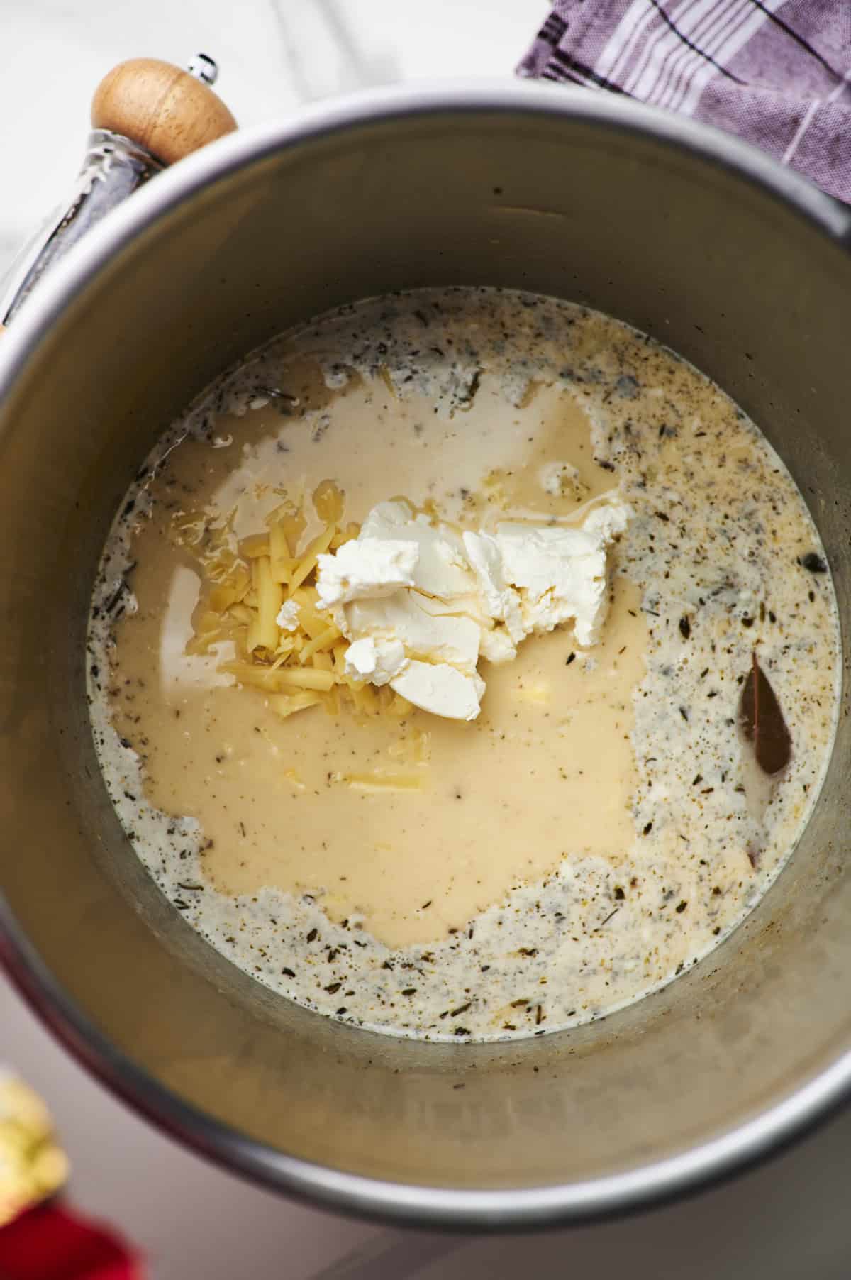 Instant pot potato soup with shredded cheddar and cream cheese. 