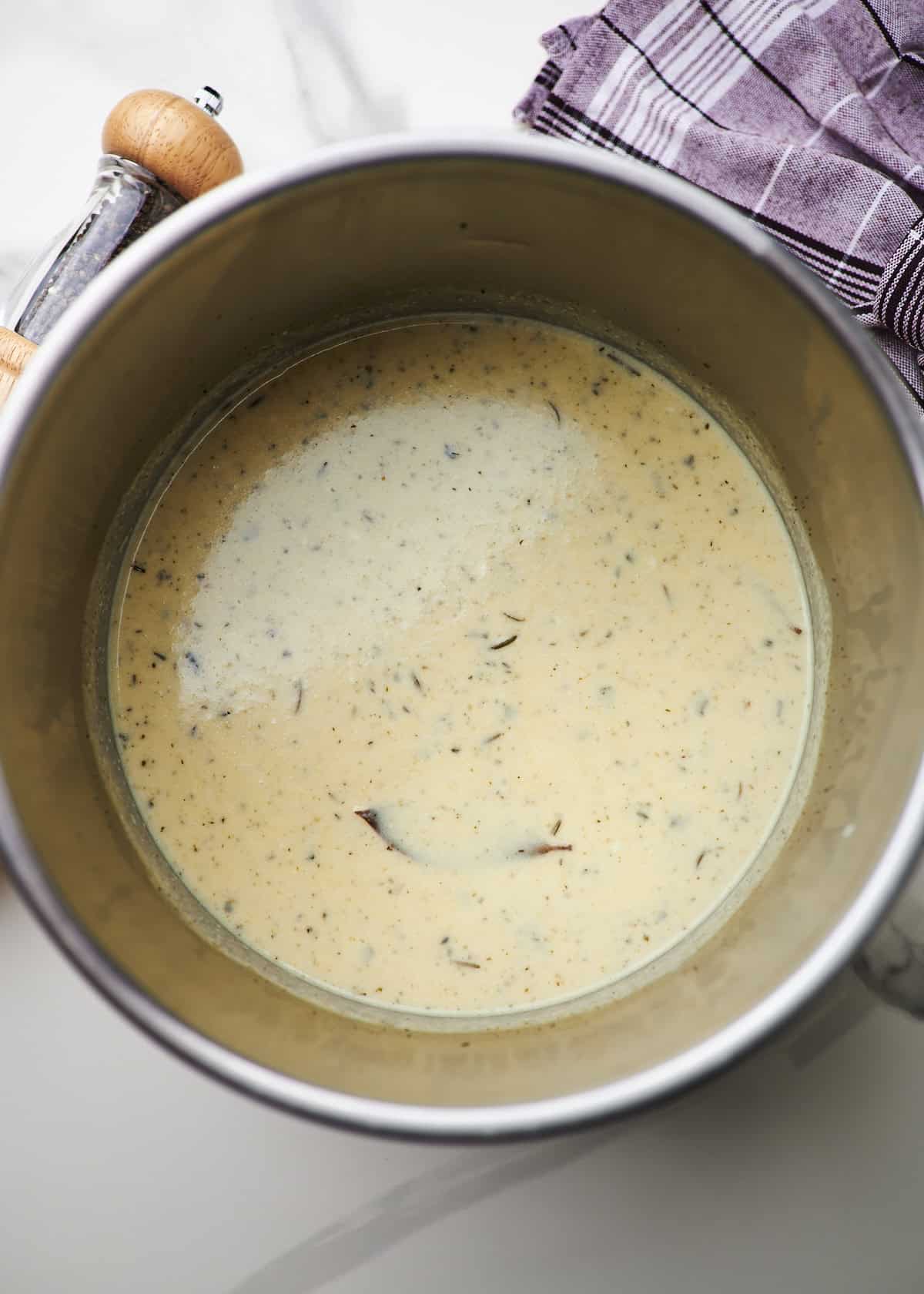 Instant pot insert filled with creamy homemade potato soup. 