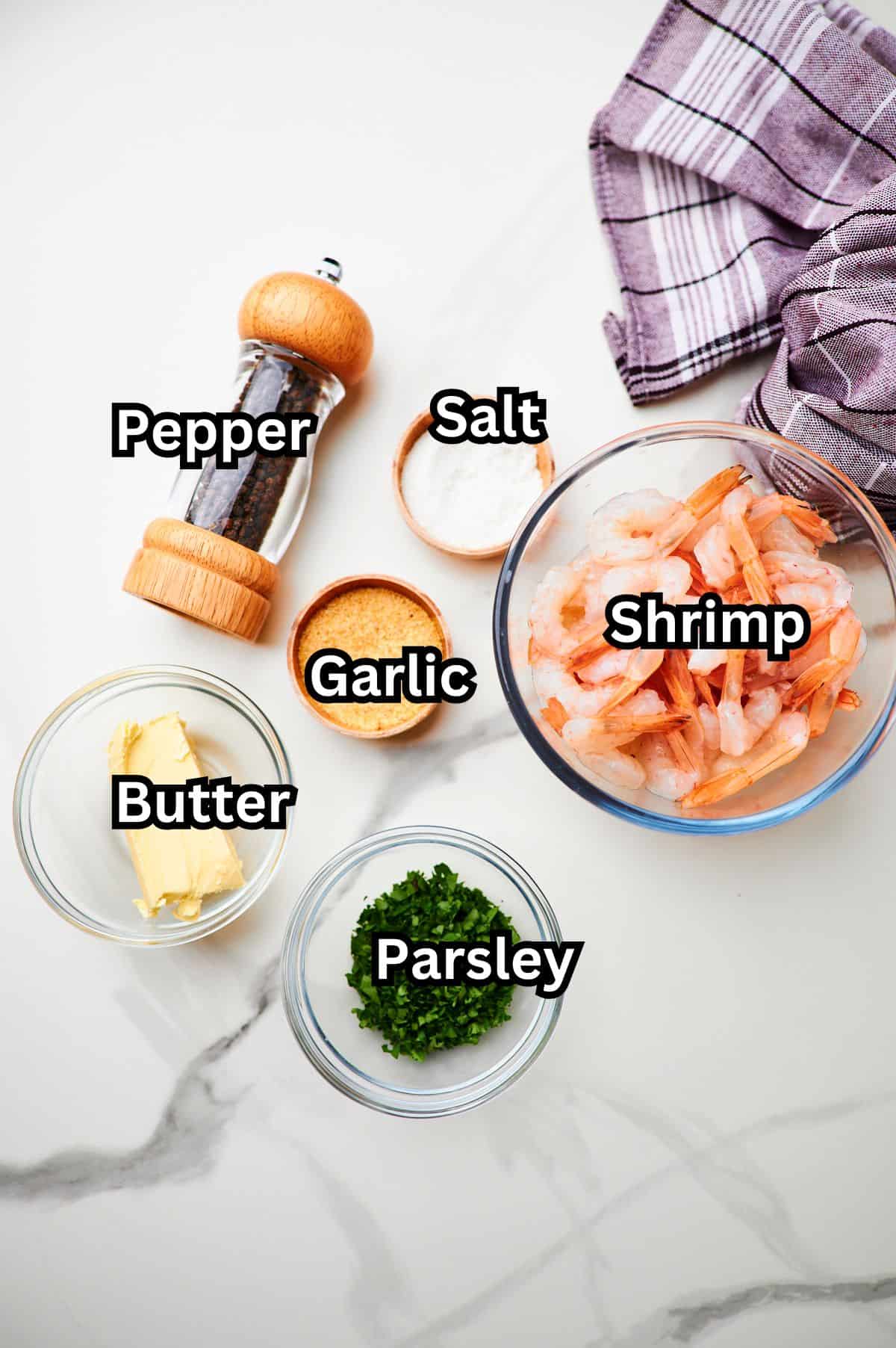 pan seared shrimp ingredients measured out on a white table