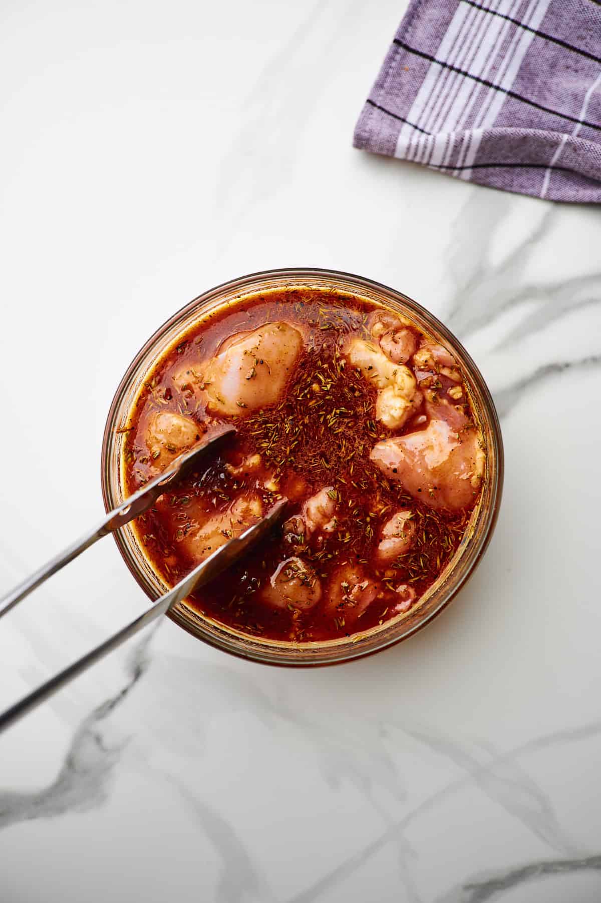 Marinating chicken thighs.