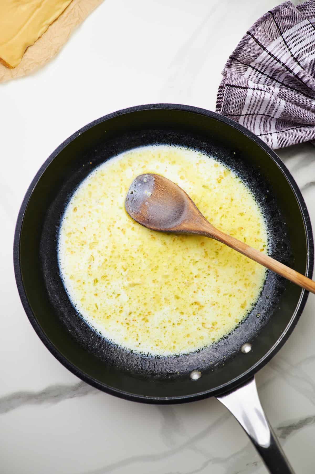 butter, garlic, and milk in a pan