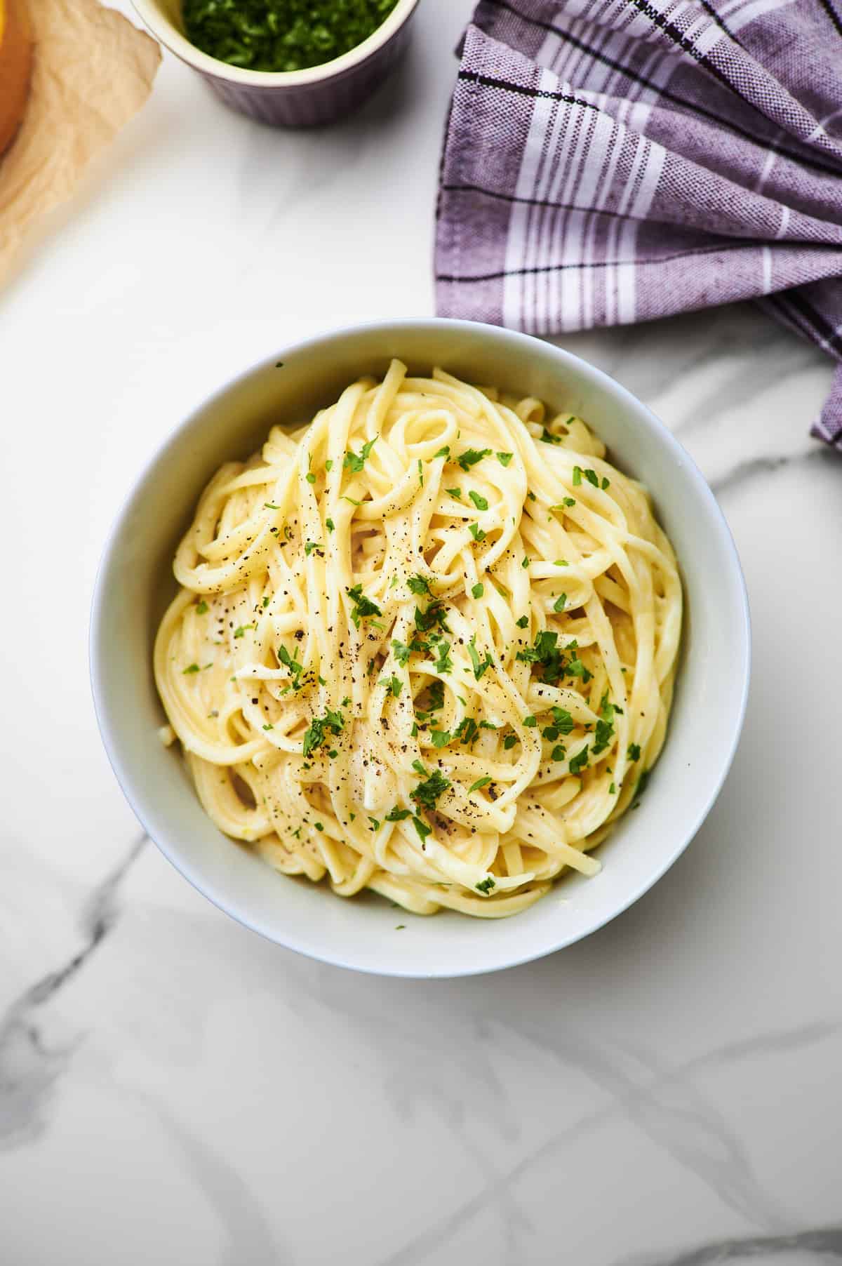 bowl of linguini pasta topped with high protein alfredo sauce