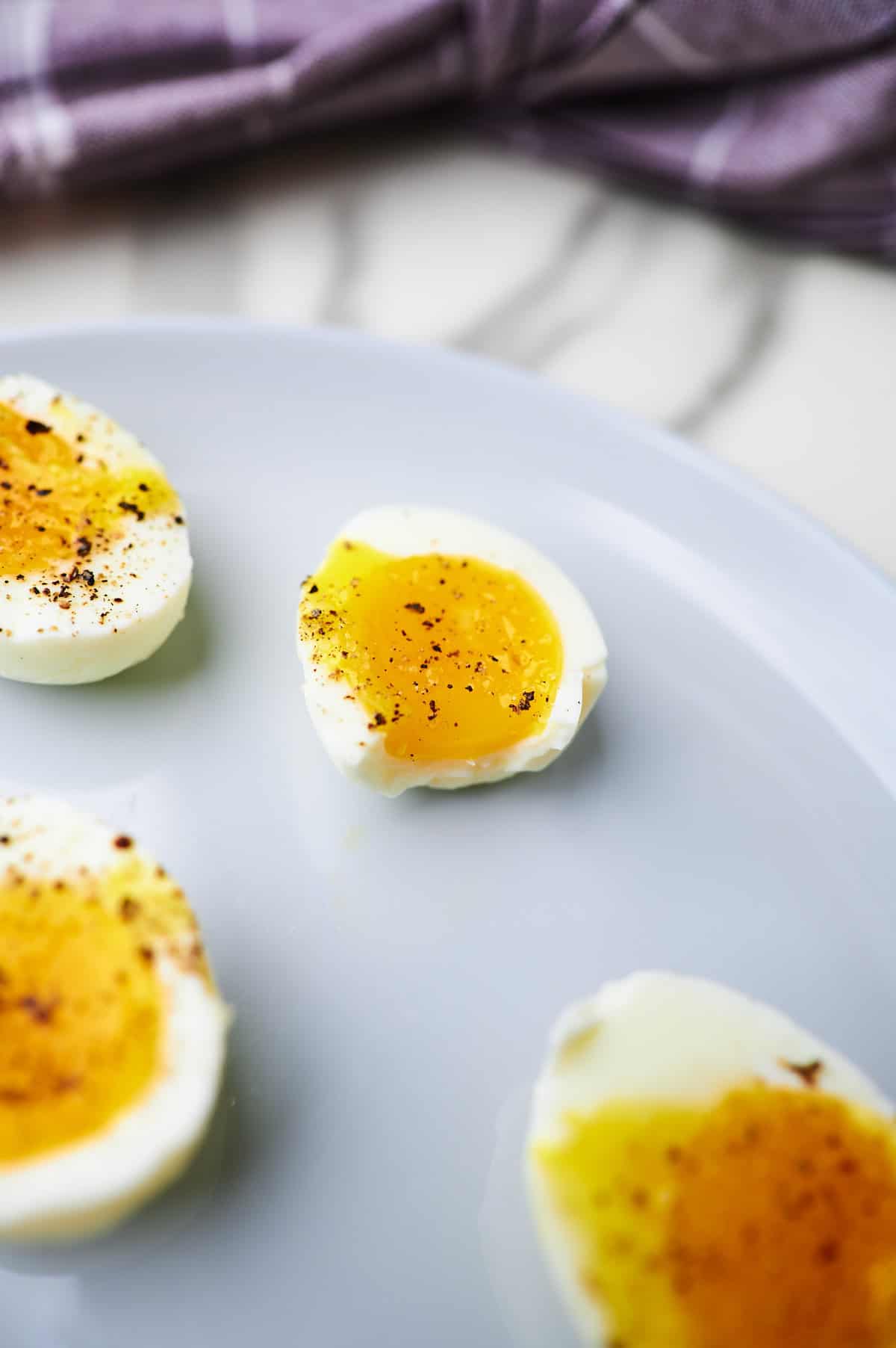 jammy egg with a bite taken out and the yolk oozing out