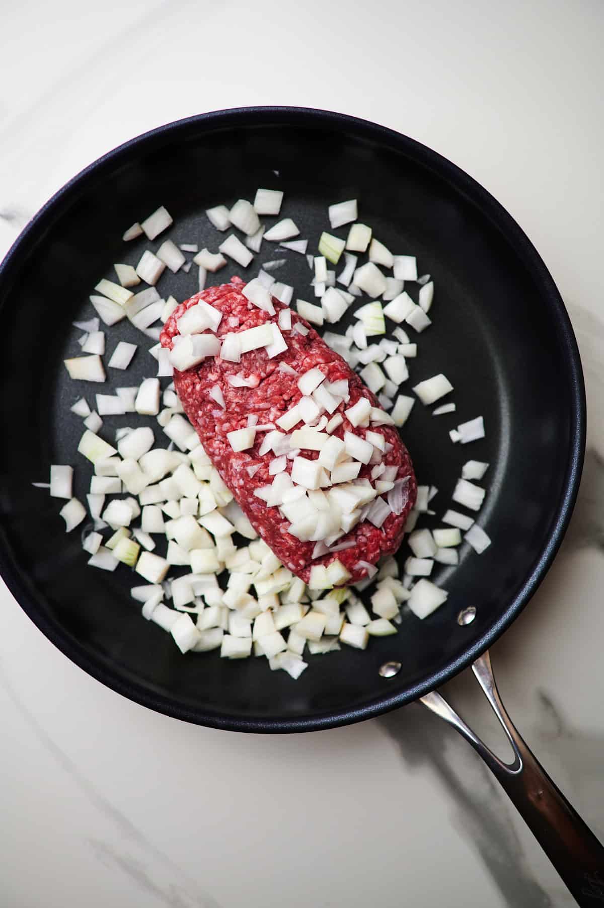 ground beef in a skillet with onions