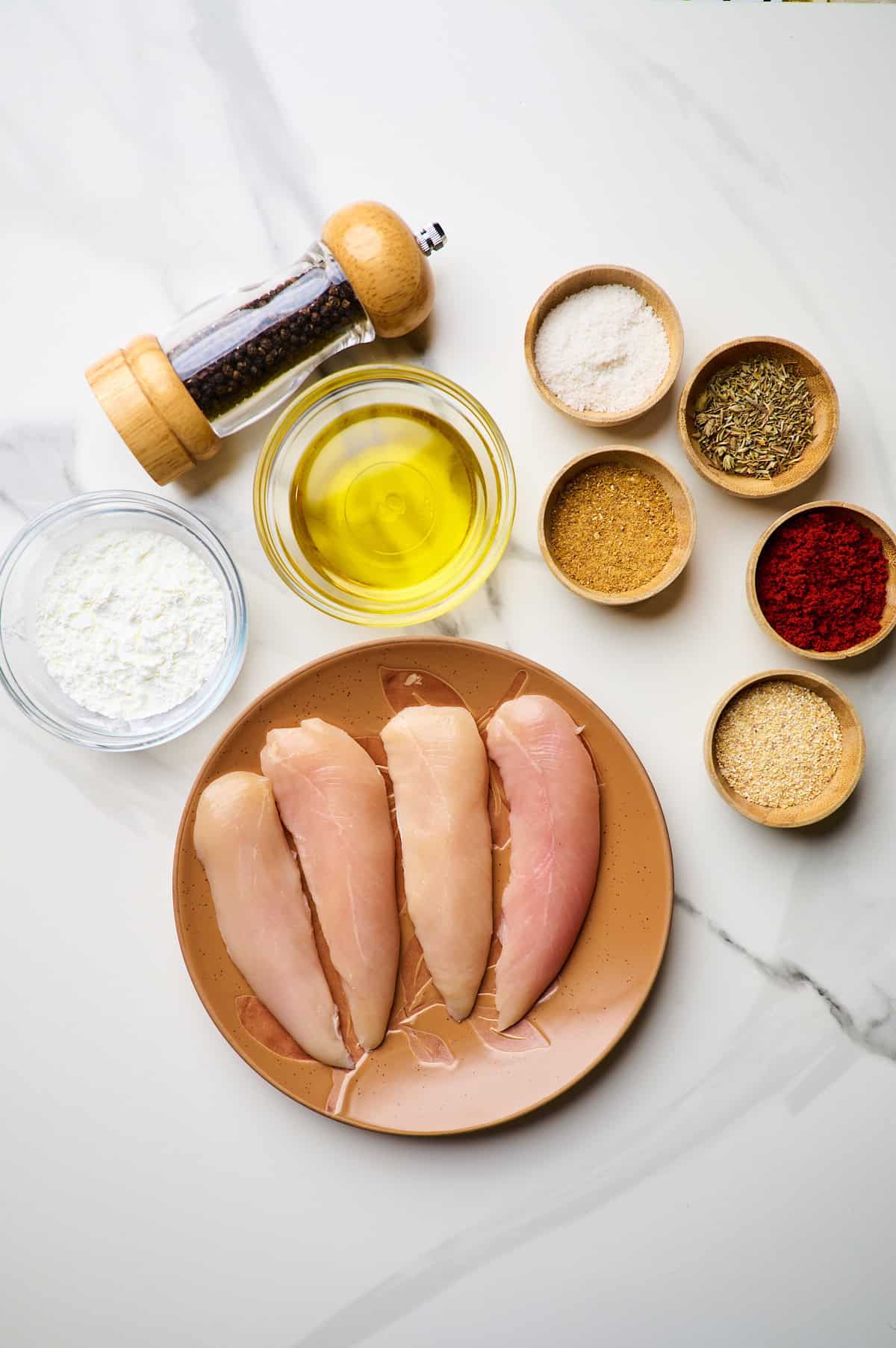 ingredient for the air fryer chicken tenderloins recipe on a white surface
